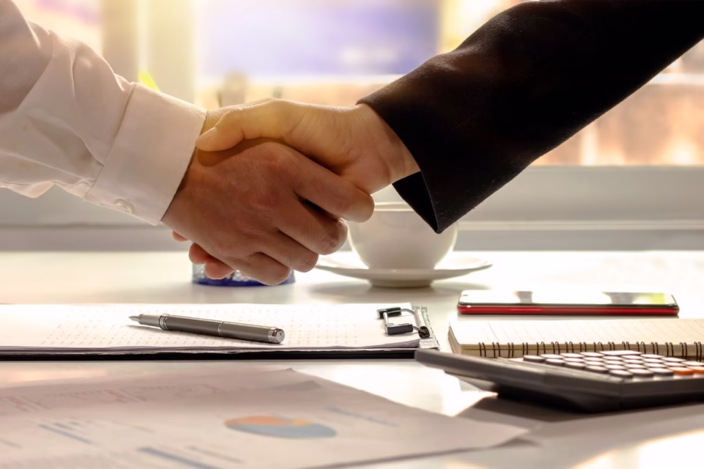 Handshake representing Partners Joining QuadraPay as as reseller